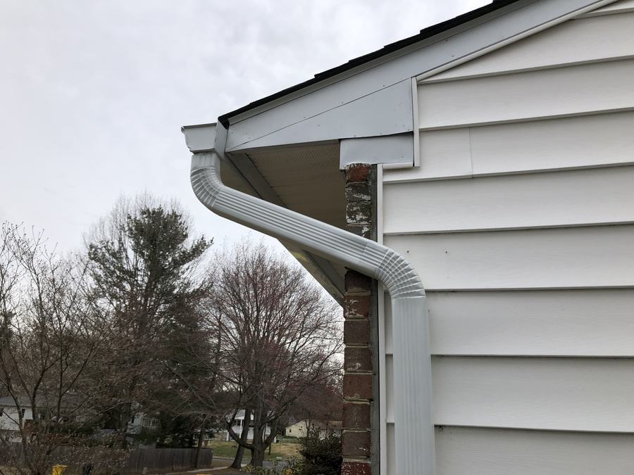 New gutter corner turning into a downspout elbow