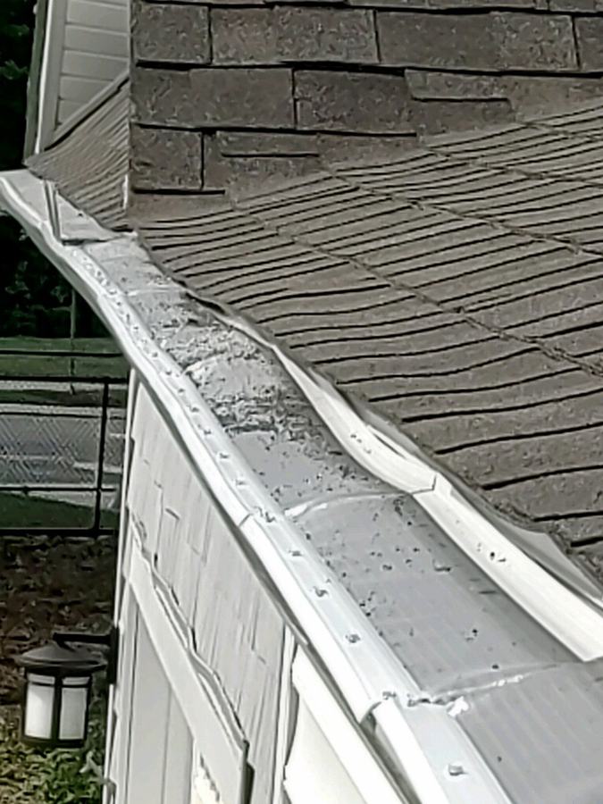 A LeafFilter gutter guard that has buckled and warped along the run
