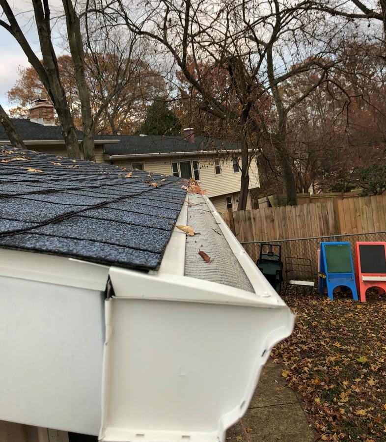 Valor Gutter Guard at a corner with leaves sitting on top, not in the gutter